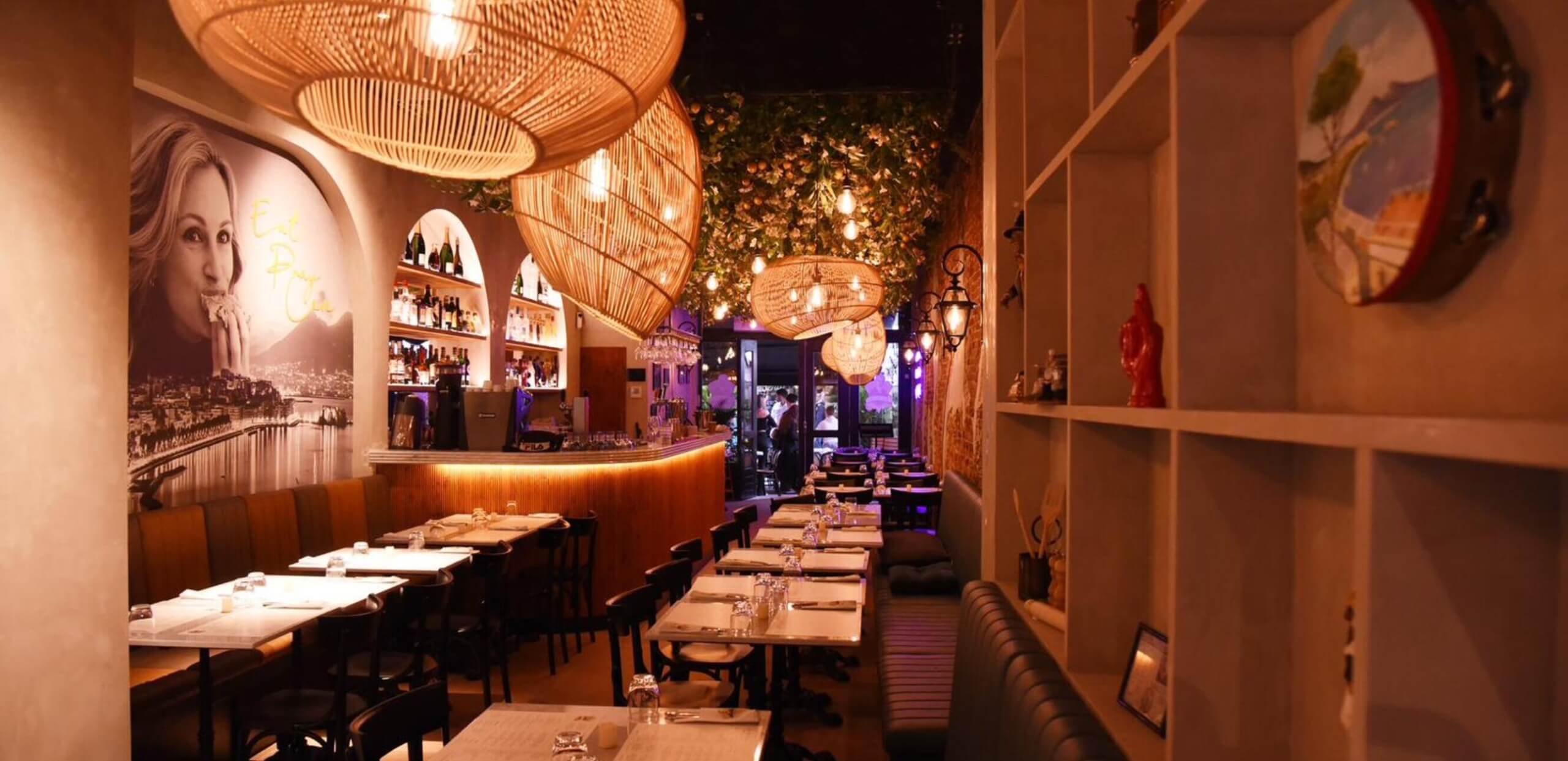 interior of pizzeria da Michele with mural of Julia Roberts